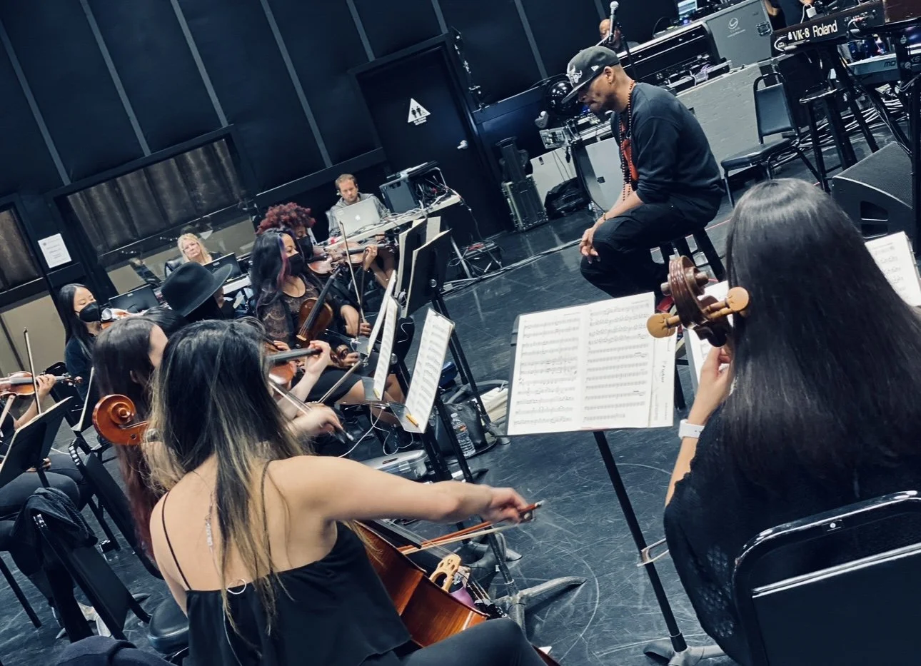 Music arranger and producer Rob Lewis conducting musicians at Center Staging in Burbank, CA for Christina Aguilera's People Choice Awards performance. 