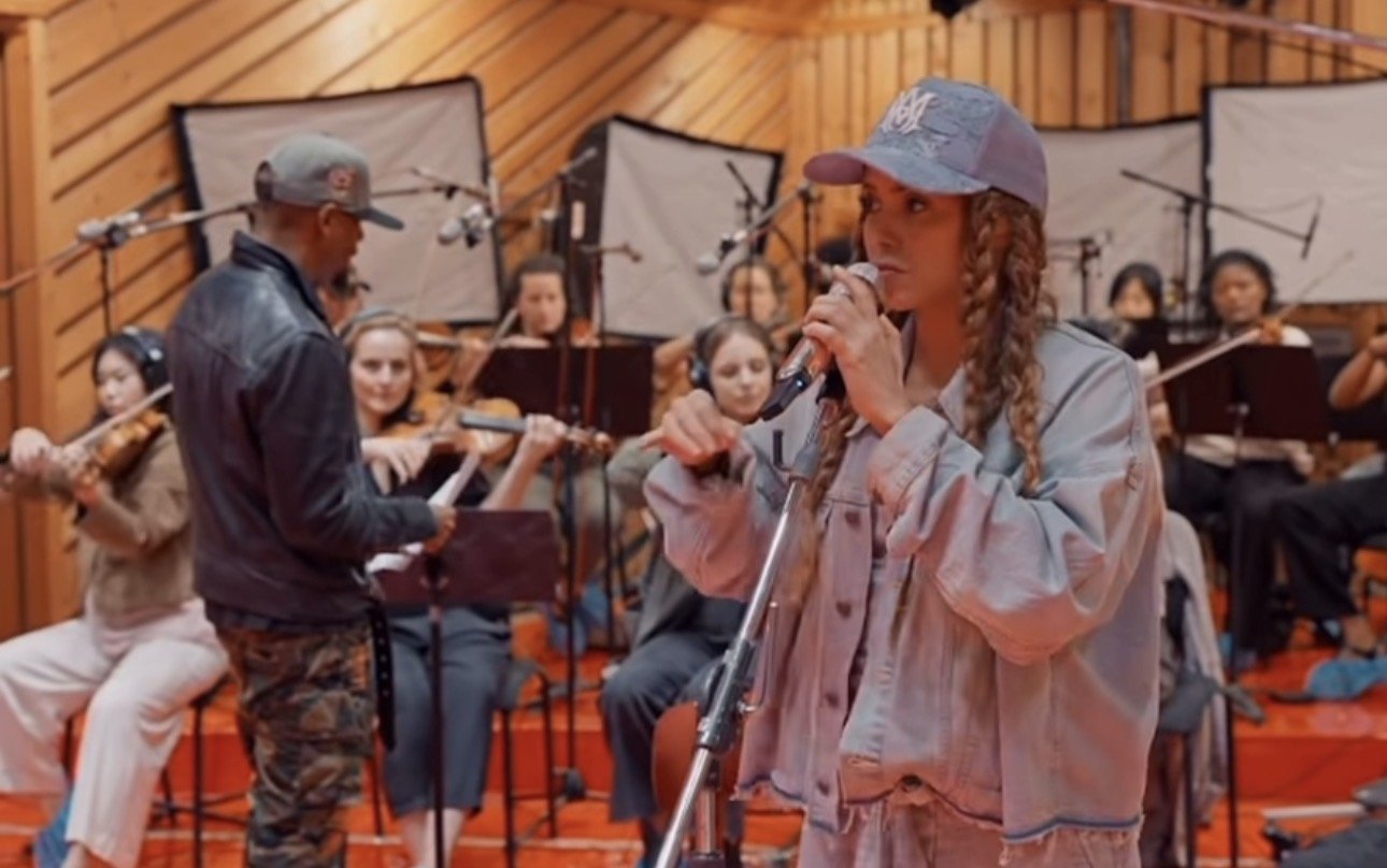 Rob Lewis leading an orchestral studio session with Shakira.