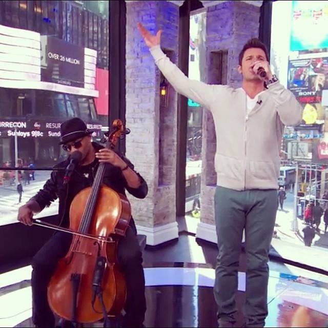 Rob Lewis on cello, with host Nick Lachey, on the set of the VH1 show "Big Morning Buzz Live".