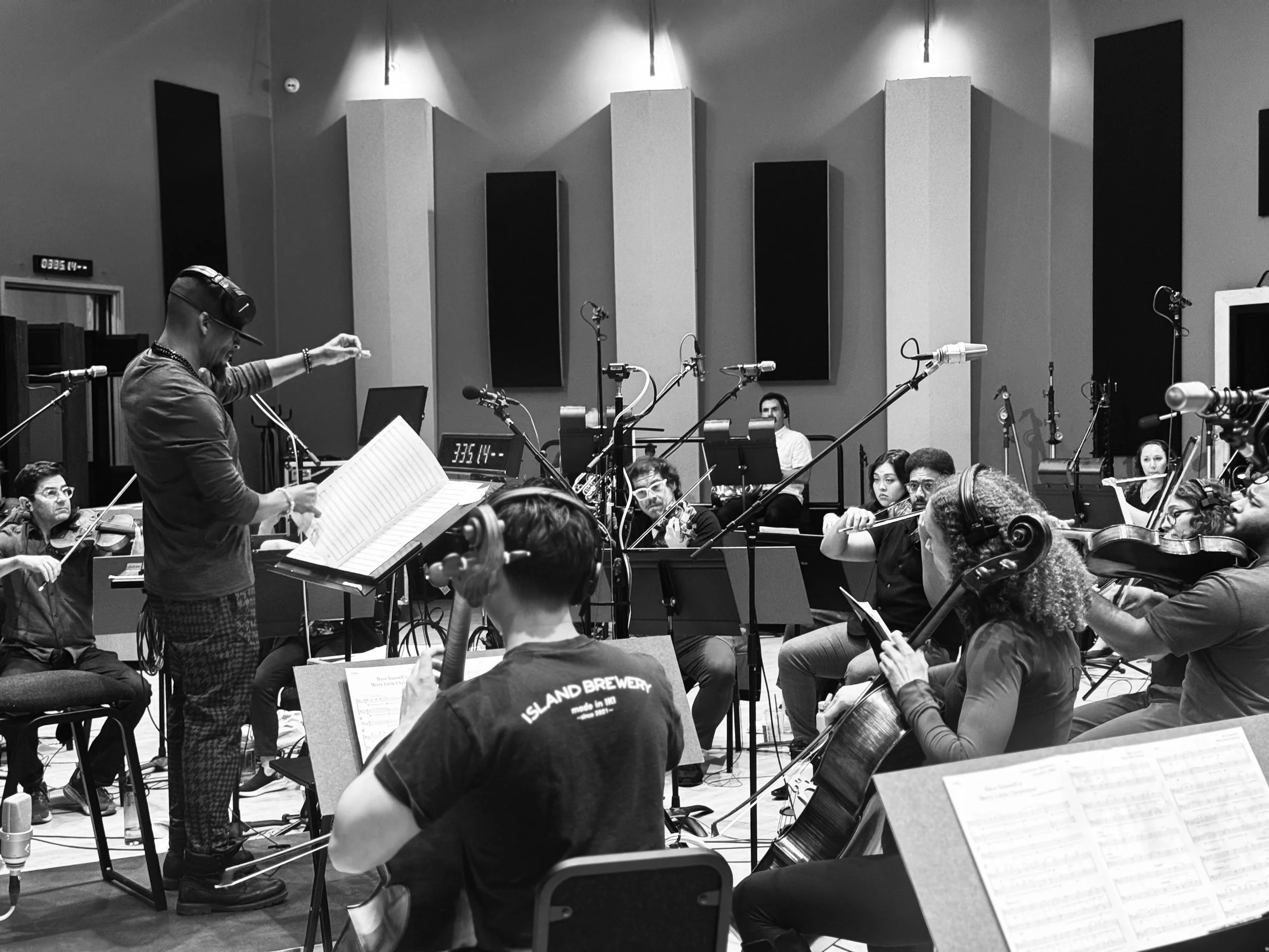 Music arranger and producer Rob Lewis conducting musicians in Evergreen Studios for Christina Aguilera's Christmas album "Christmas In Paris", 2025.