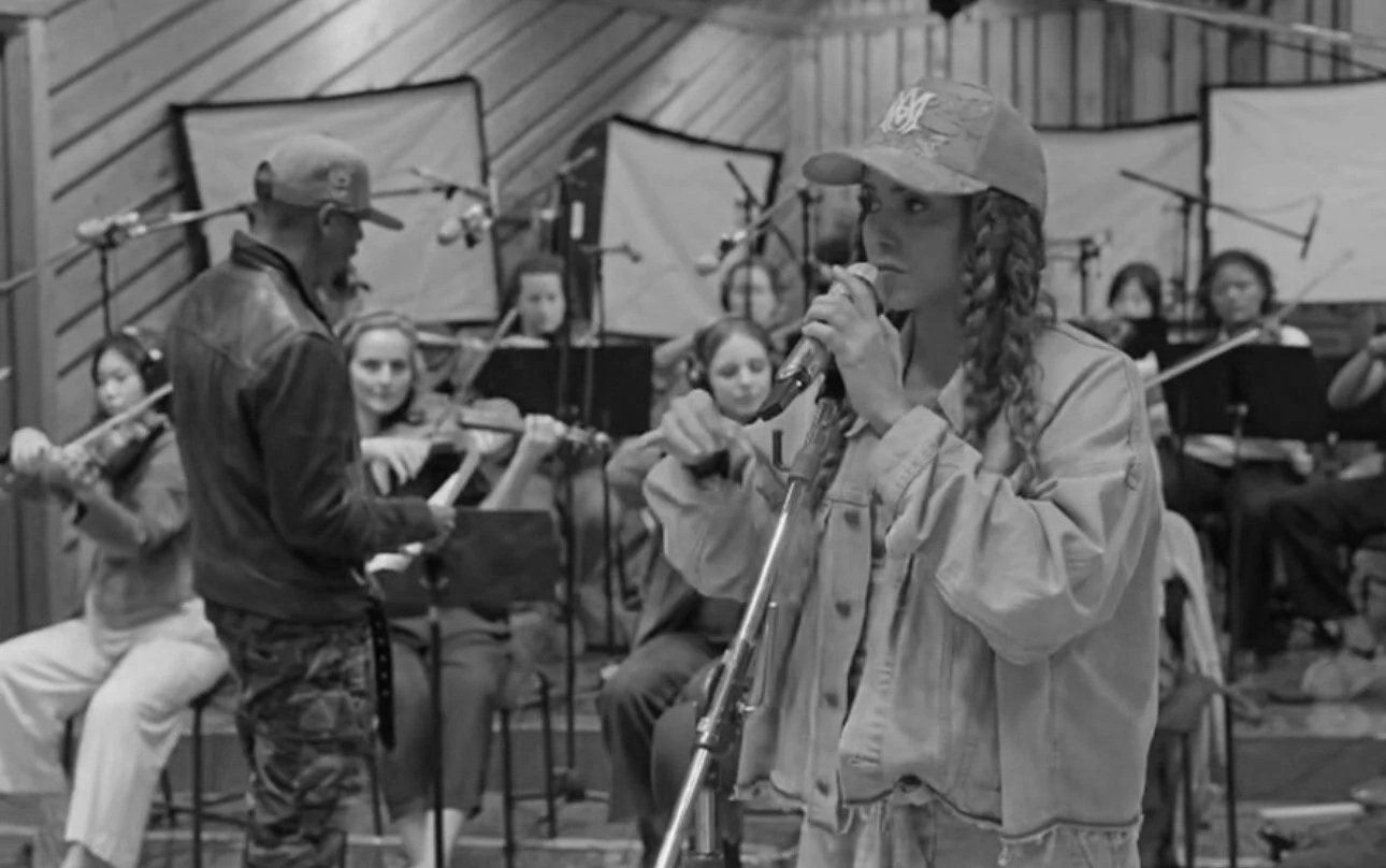 Rob Lewis leading an orchestral studio session with Shakira.