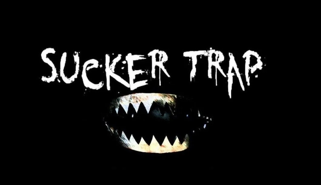 Graphic with the words 'Sucker Trap' and a stylized menacing mouth with sharp teeth on a black background.