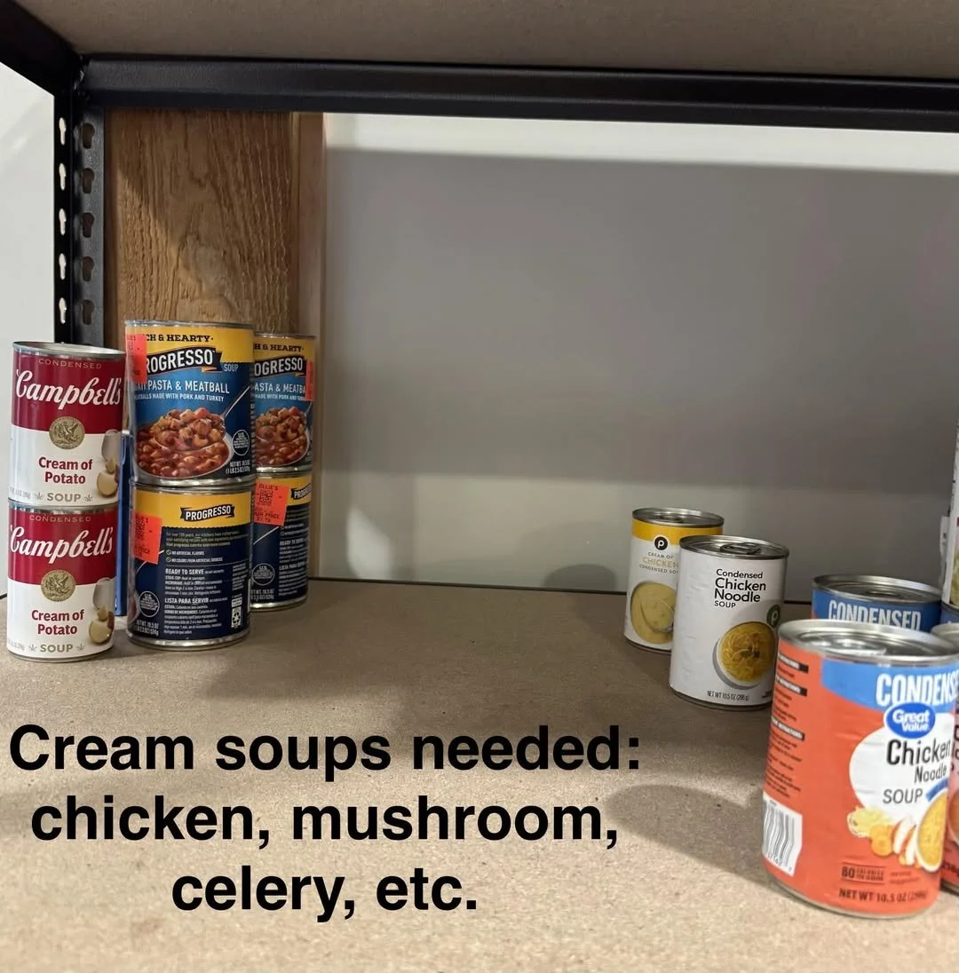 Shelves with cans of soup, including Campbell's cream of potato and Progresso pasta and meatball, and other soup cans labeled chicken and noodles, with text overlay stating 'Cream soups needed: chicken, mushroom, celery, etc.'