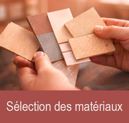 Person holding small sample tiles of various materials for selection.