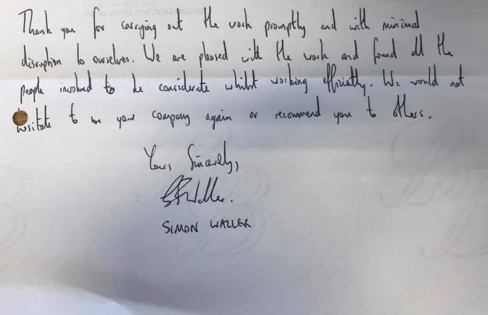 A handwritten note on a piece of paper, expressing gratitude for prompt work and mentioning satisfaction with how the work was done for K G Croft Builders. The note is signed by Simon Walker.