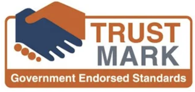 Logo with two hands shaking, the words "TRUST MARK," and the phrase "Government Endorsed Standards" in orange and gray.