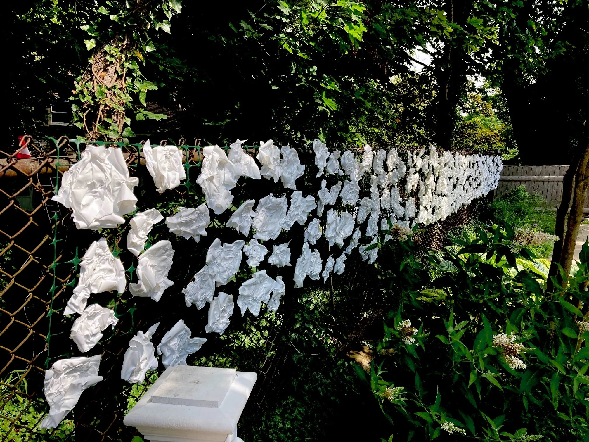 Sweet Autumn Stream,  480"x30"x6” Marine shrink wrap, stainless steel wire, plastic fencing
(Ongoing at The Sculpture Garden at The Commons, Provincetown MA) 
