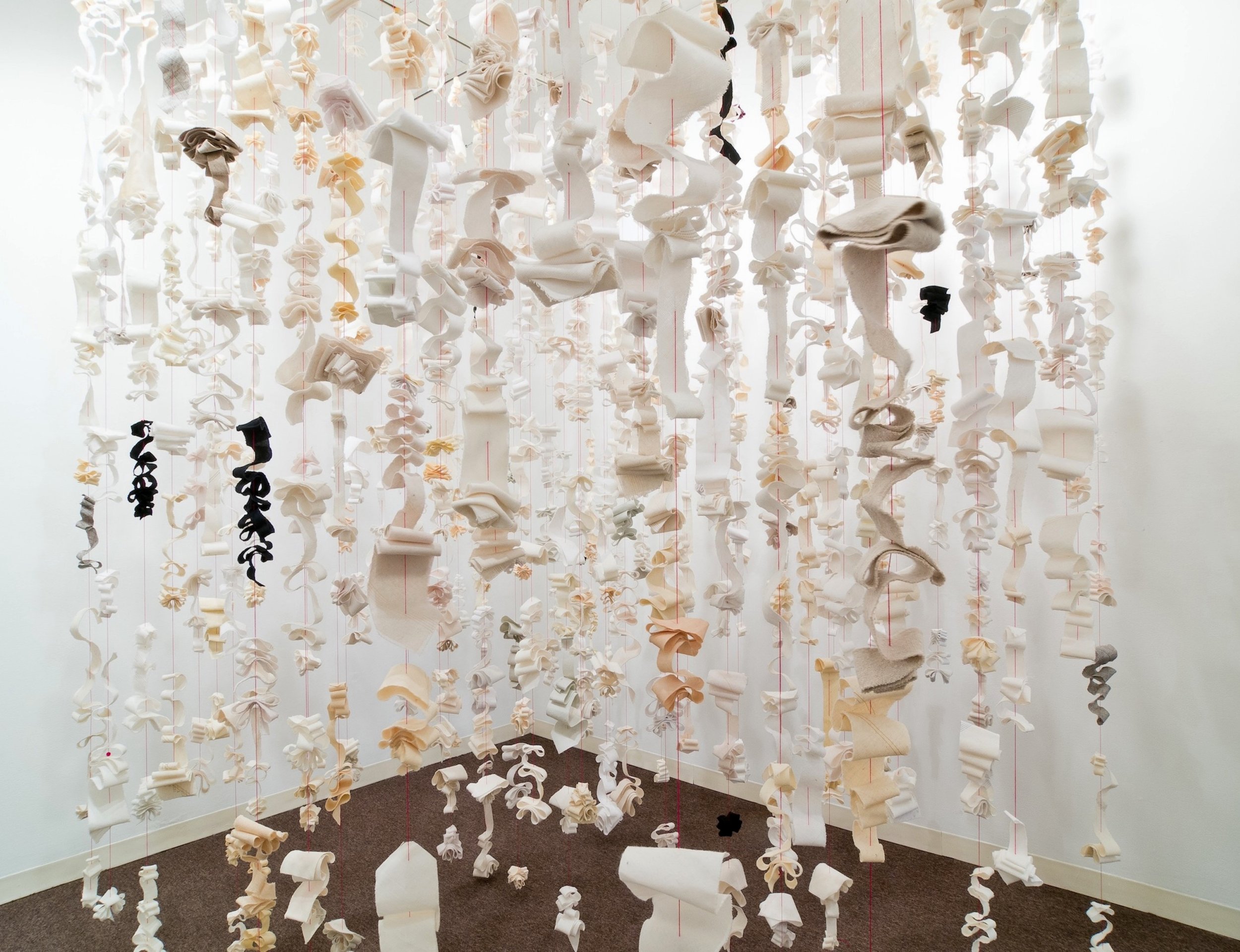 Untied 96"x96"x72” Linings from silk neckties, red embroidery thread, red wooden beads