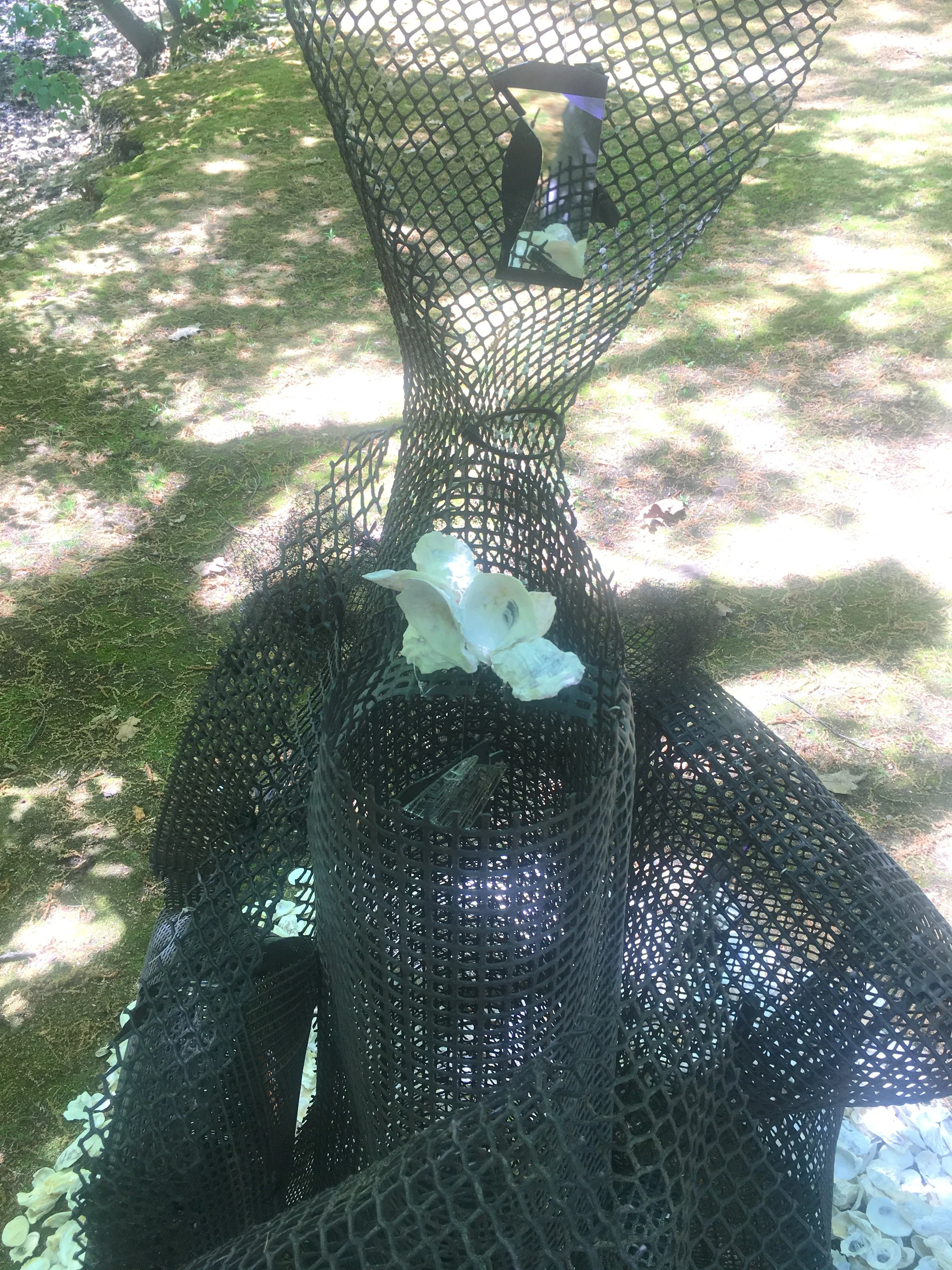 Pleiades,  72"x60"x60” Oyster grow bags, oyster shells, mirrors, zip ties, tie rod 
(The Light Gets In, Studios Without Walls, Brookline, MA)
