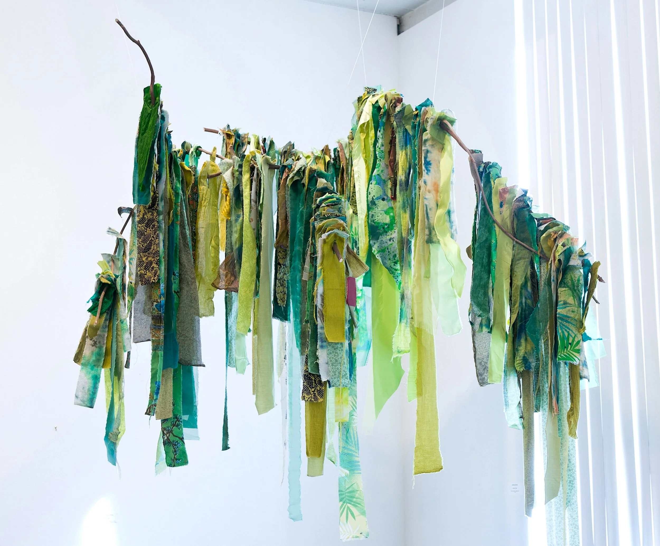 Inhaling Spring,  60"x96"x30” Fabrics, thread, wisteria branches