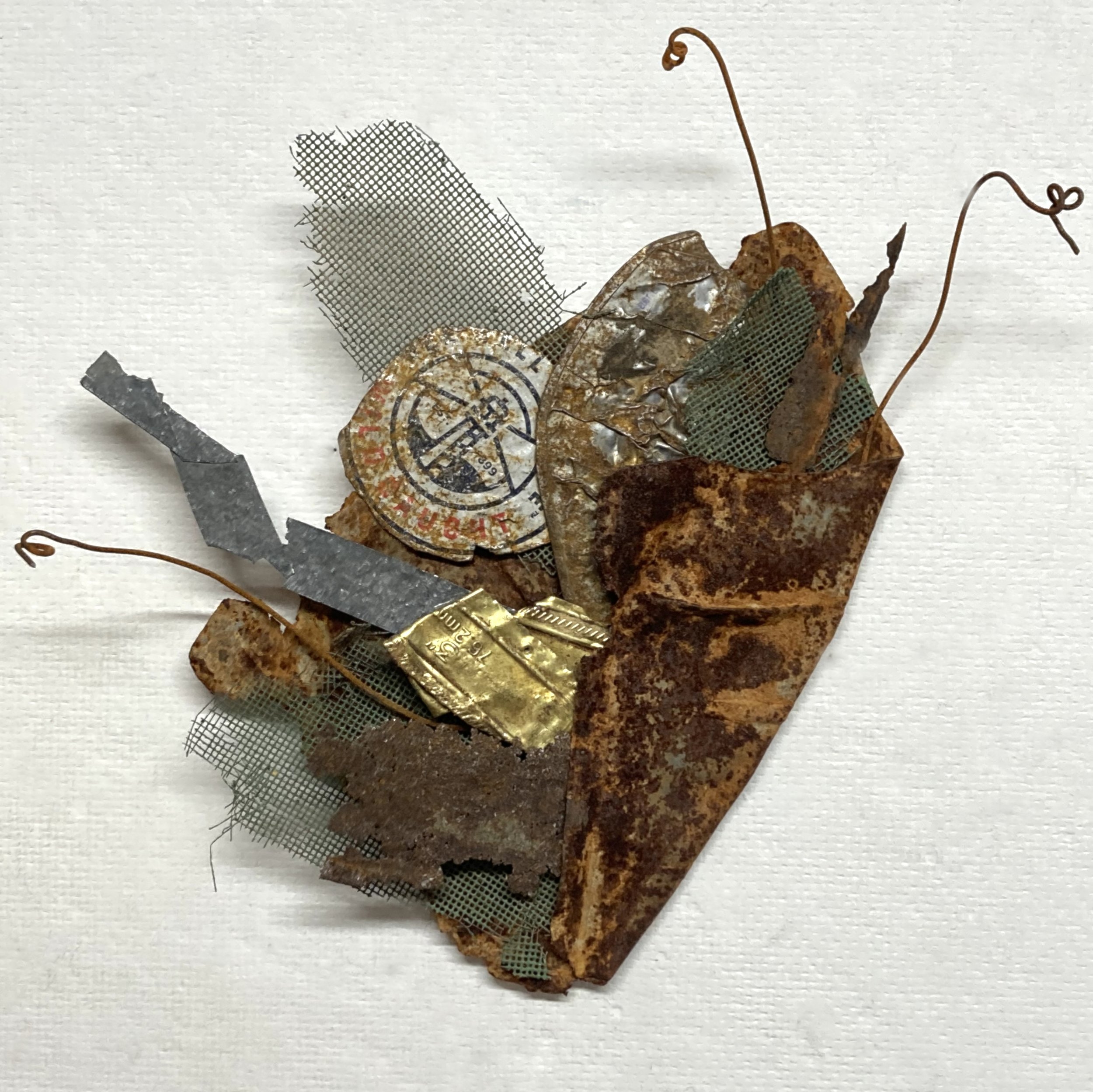 Banksy’s Bouquet,  12"x9"x3” Found metal: car parts, cans, wire mesh