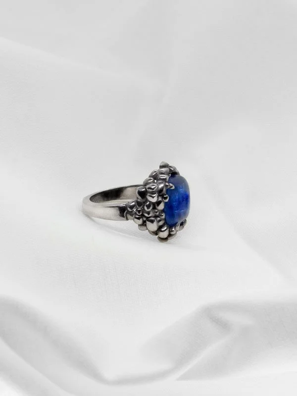 Silver ring featuring a vibrant kyanite gemstone set in a textured organic cluster, handmade statement jewelry by Cadera Jewelry