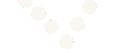 A string of white beads arranged in a curved line on a black background.