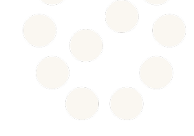 Pattern of white circles arranged in a triangle shape on a black background.