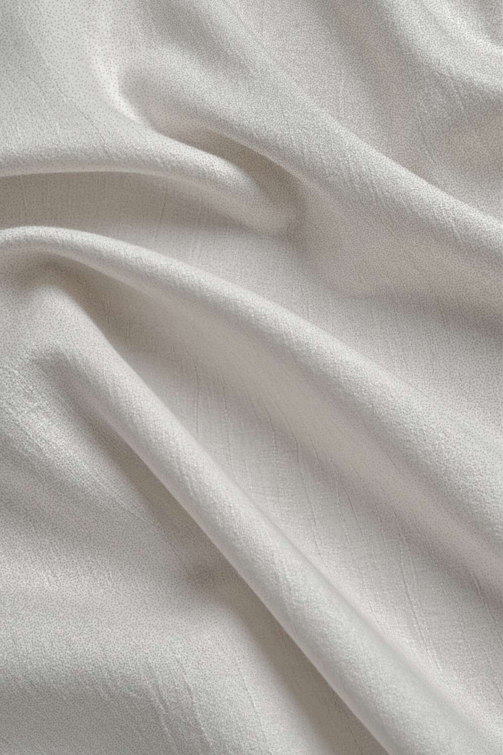 gently folded cream linen fabric