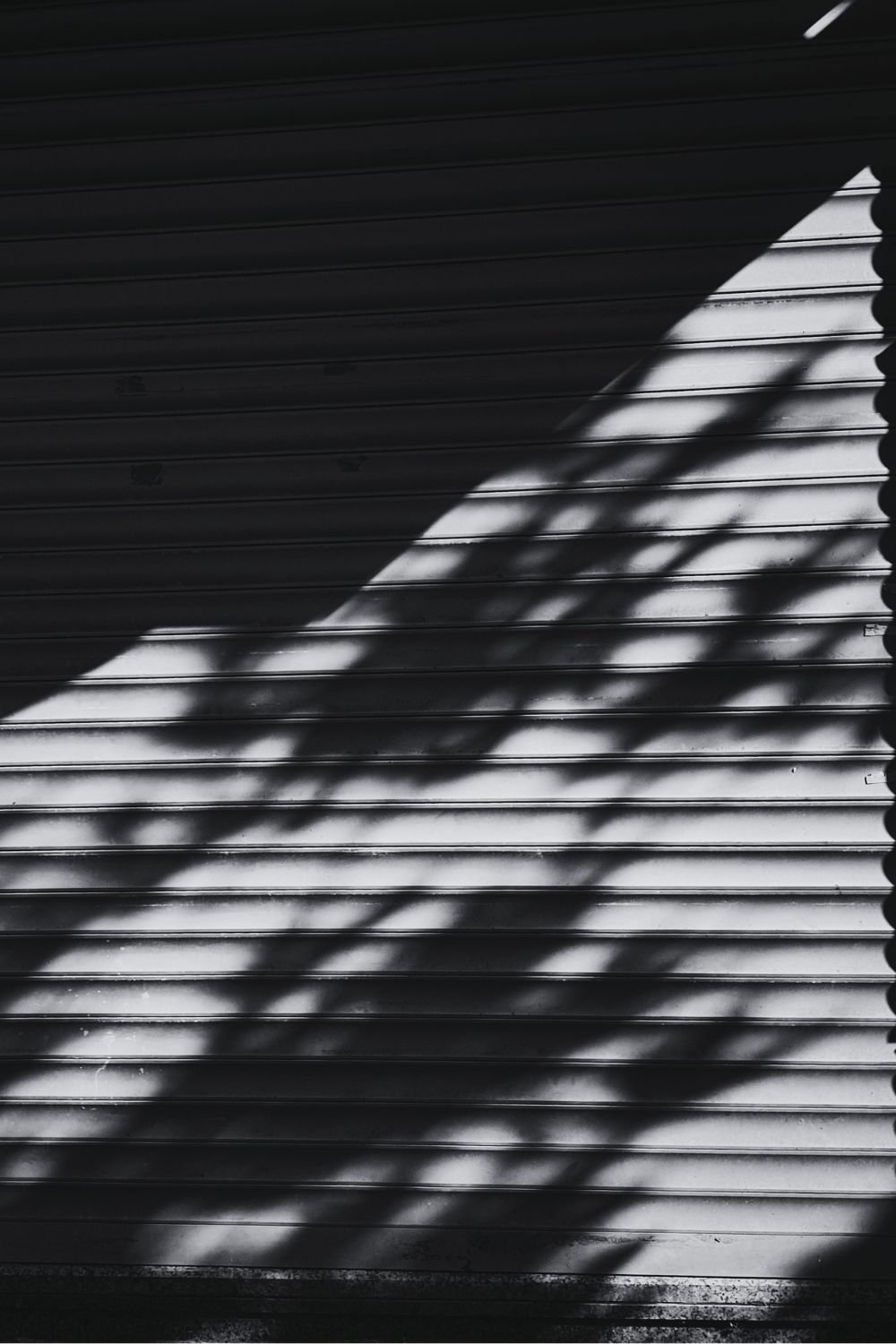 Abstract shadows on a striped wall
