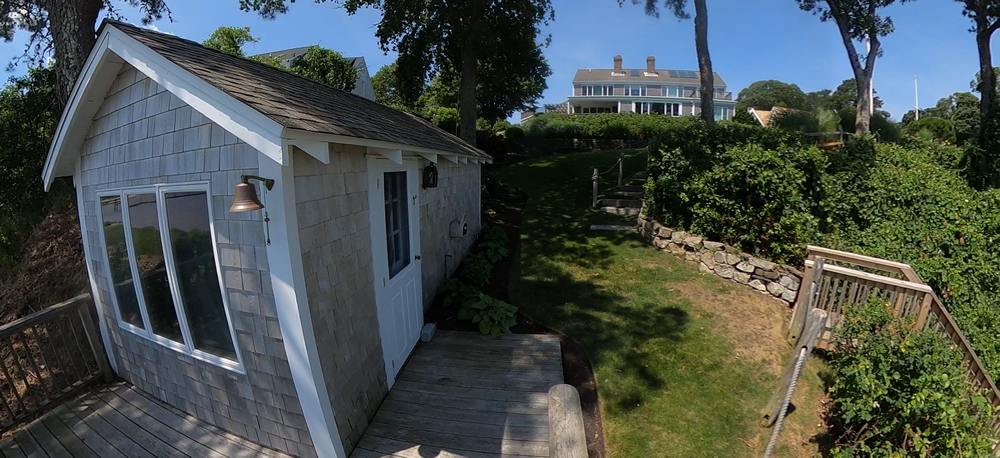 Little Bay main home and boat house showing property-scale context