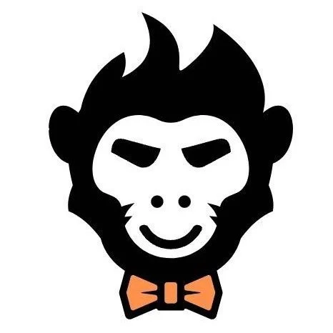 Black and white cartoon monkey face with a bow tie.