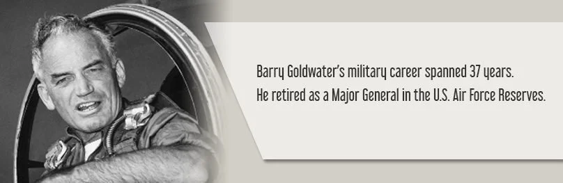 Black and white image of Barry Goldwater in a military uniform, smiling and looking off to the side. Accompanying text states he served 37 years in the U.S. Air Force Reserves and retired as a Major General.