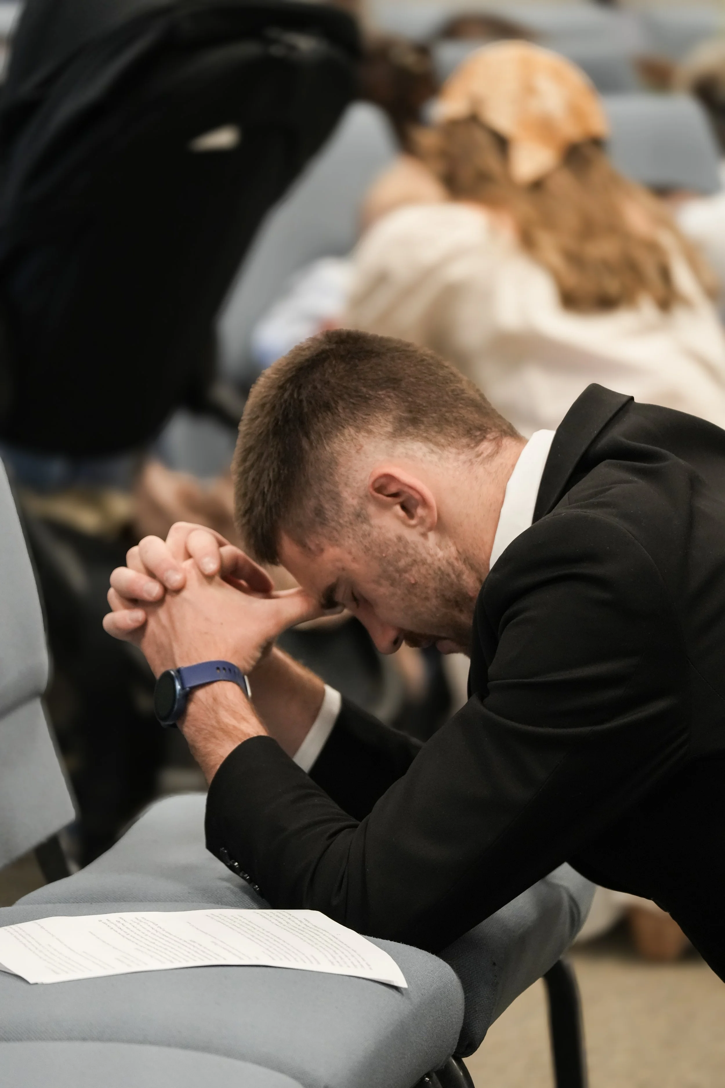 Man kneeling for corporate confession