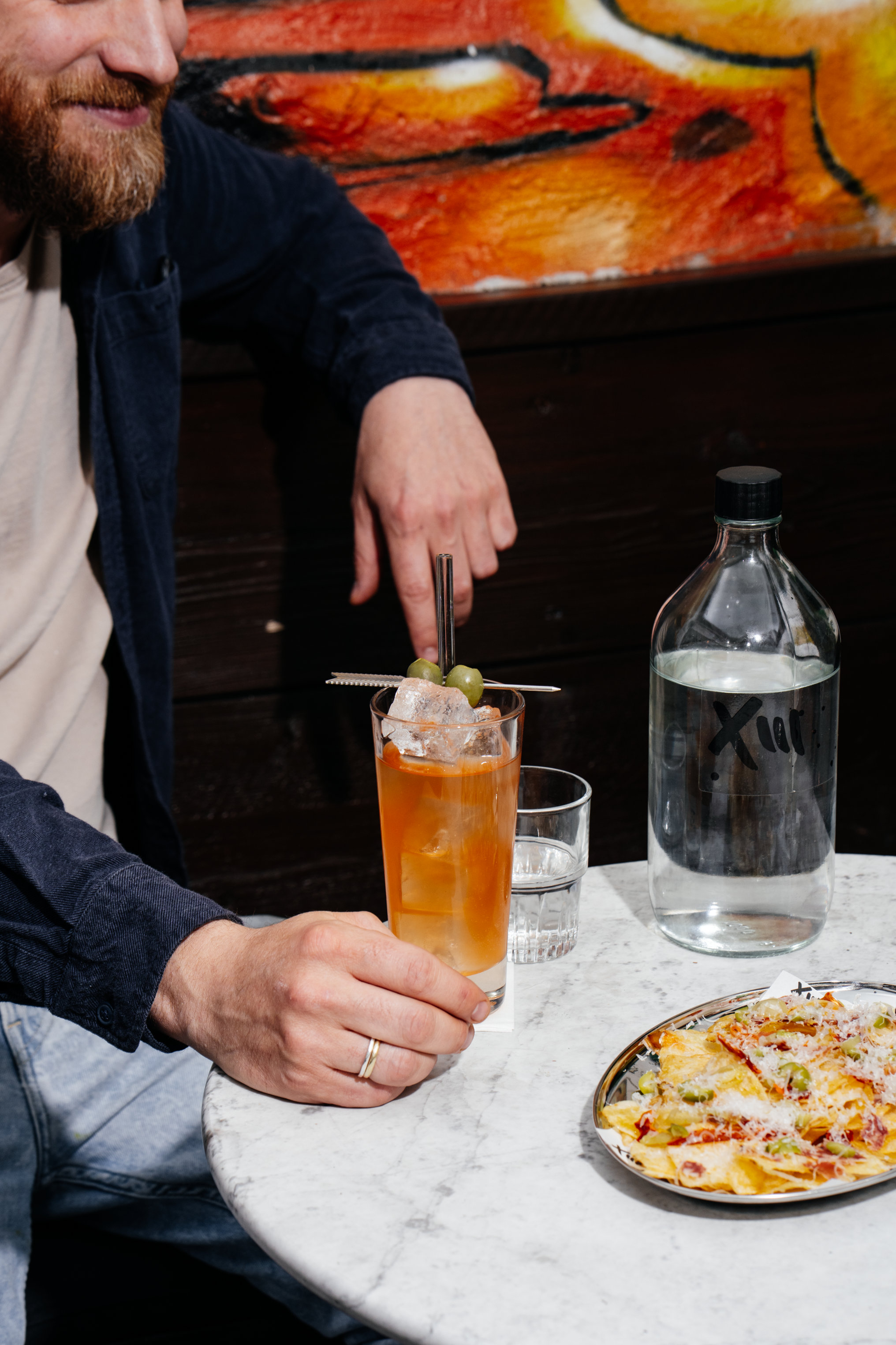 Cocktail and nachos in the Filthy XIII beer garden, Bristol