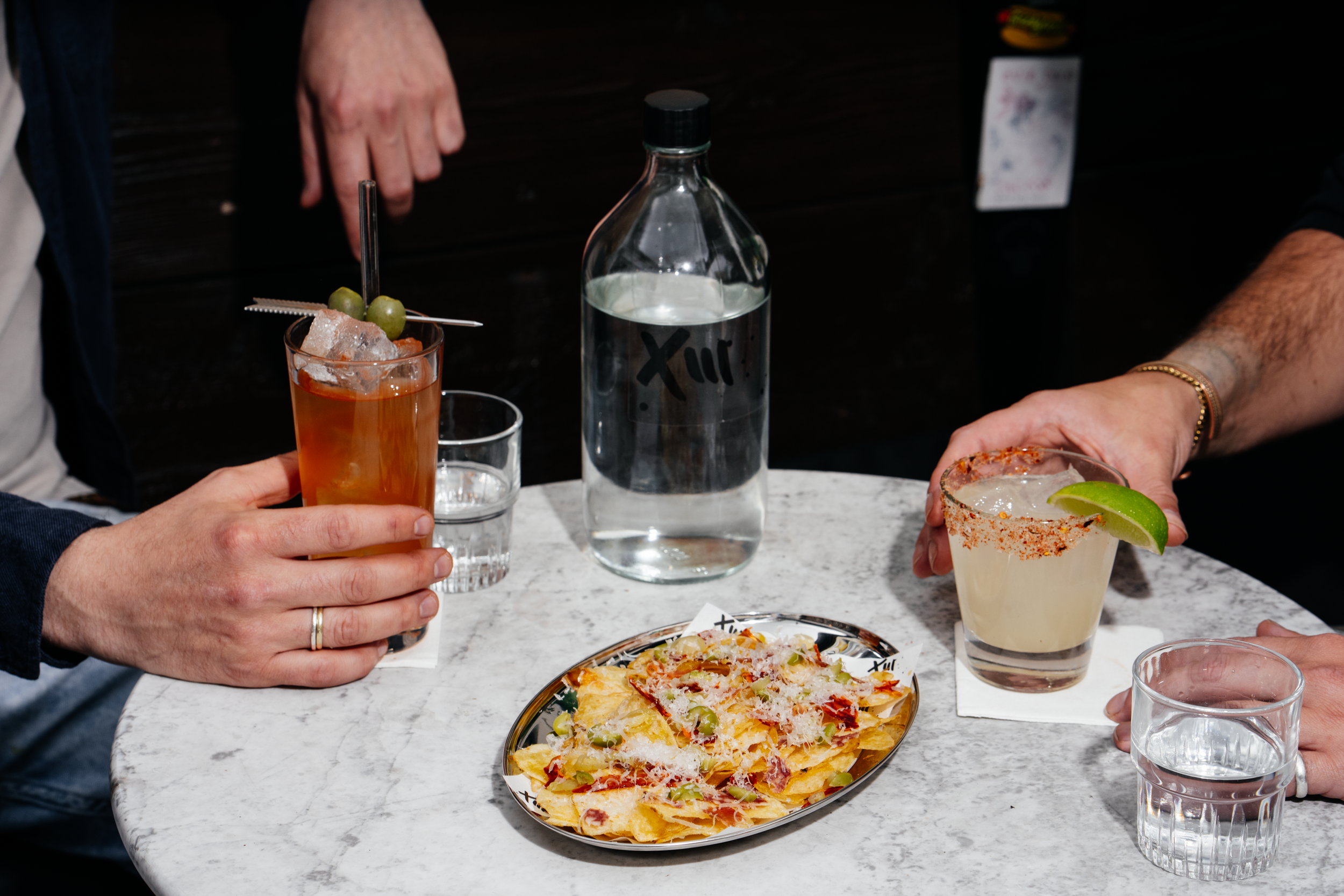 Cocktails and nachos at Filthy XIII cocktail bar in Bristol