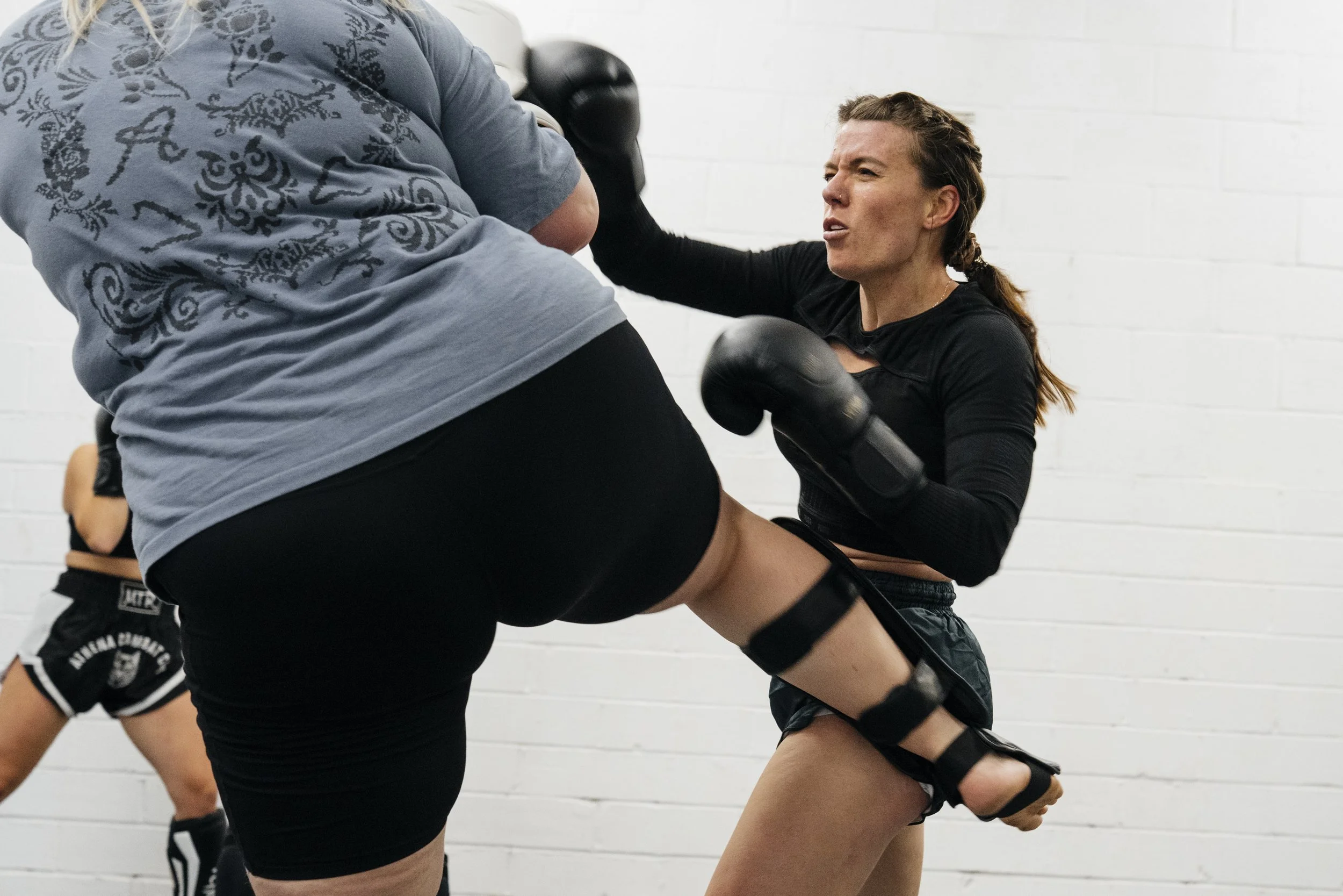 Muay Thai fighters sparring at Athena Combat Club Fighter's Class