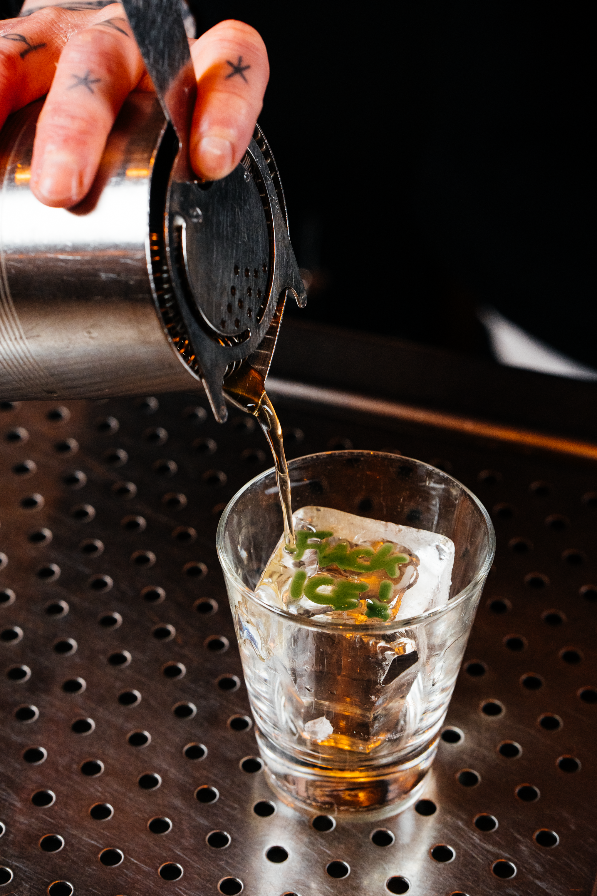 Cocktail being poured over ice with "Fuck Ice" engraved at Filthy XIII, Bristol