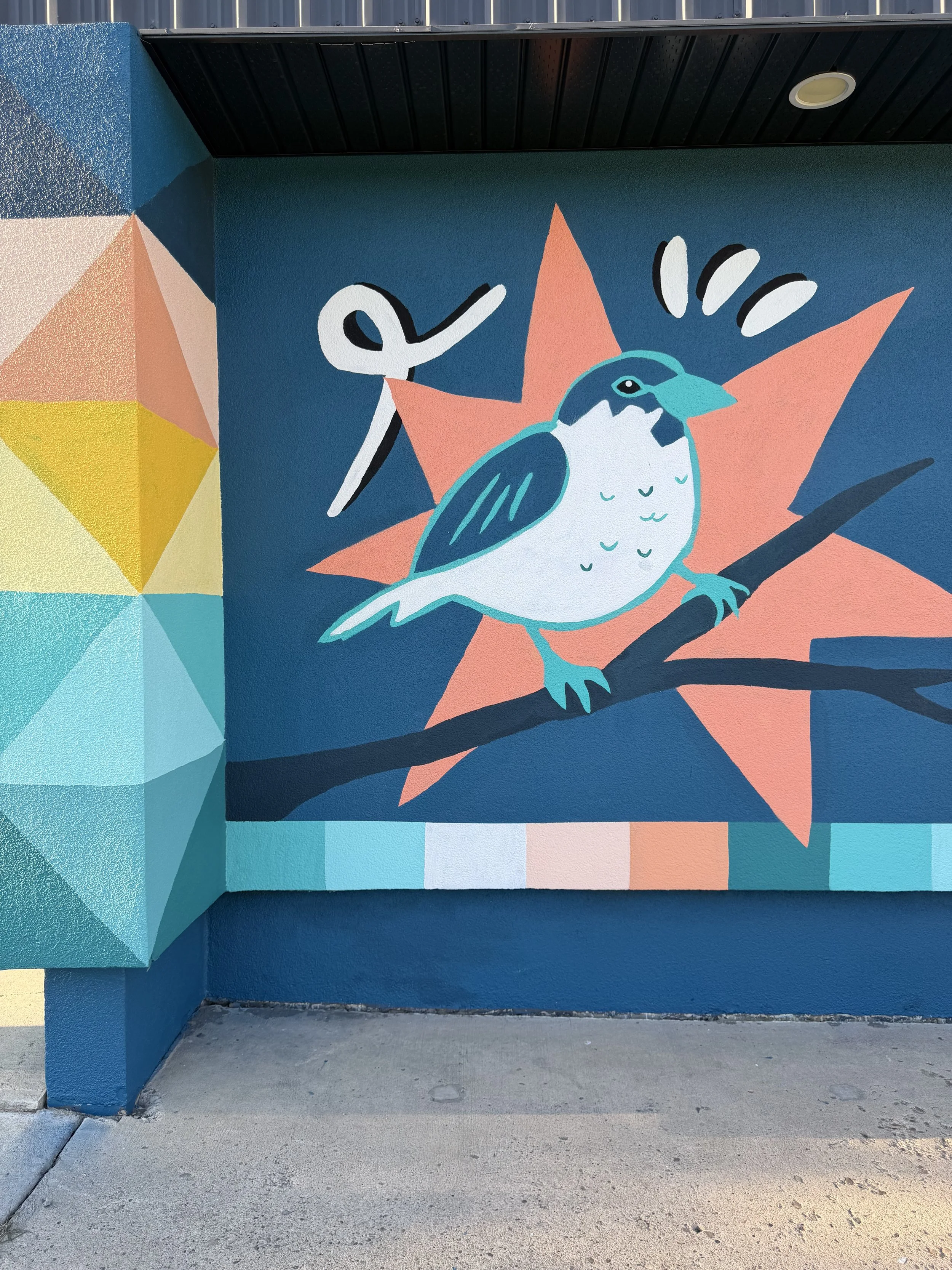 Close-up of a bird mural at Aspen Gardens