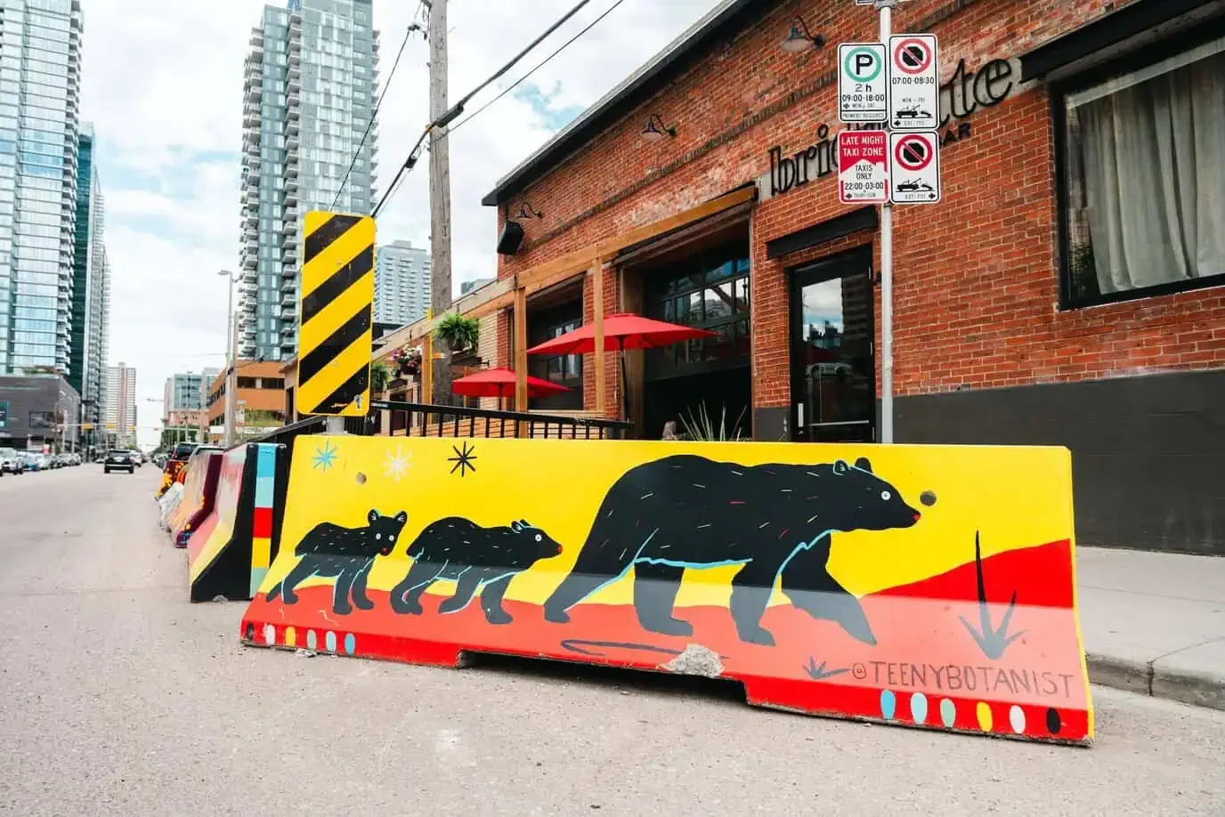 Jersey barrier with a bear mural on a Calgary street