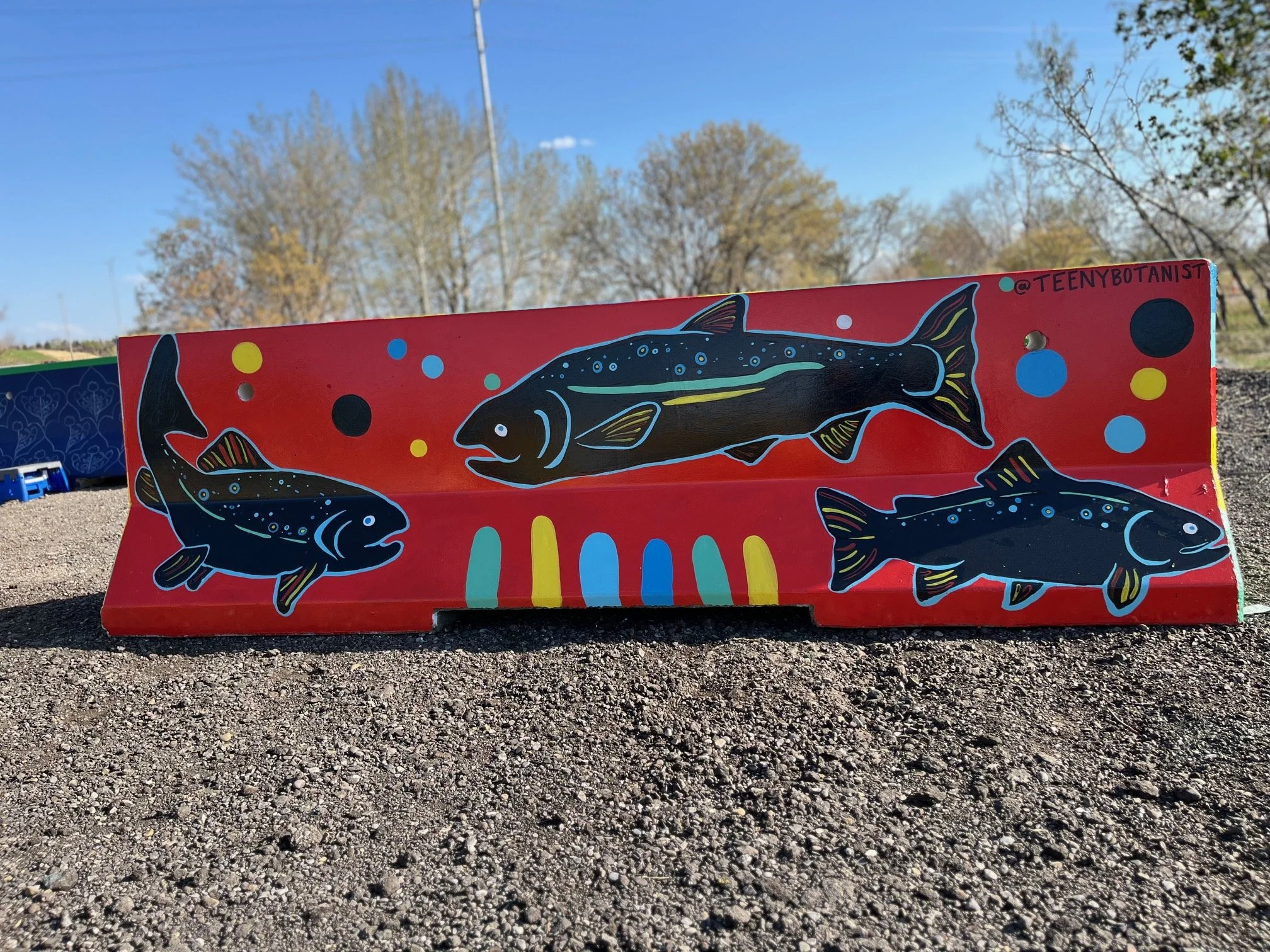 Jersey barrier with fish on red, BUMP Road Works by Teenybotanist