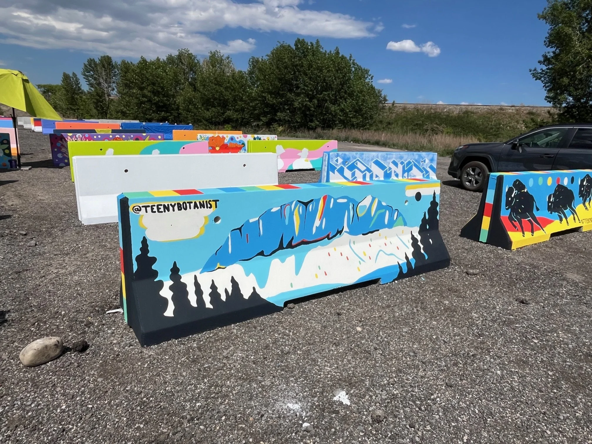 Jersey barrier with a mountain and forest design, BUMP Road Works by Teenybotanist