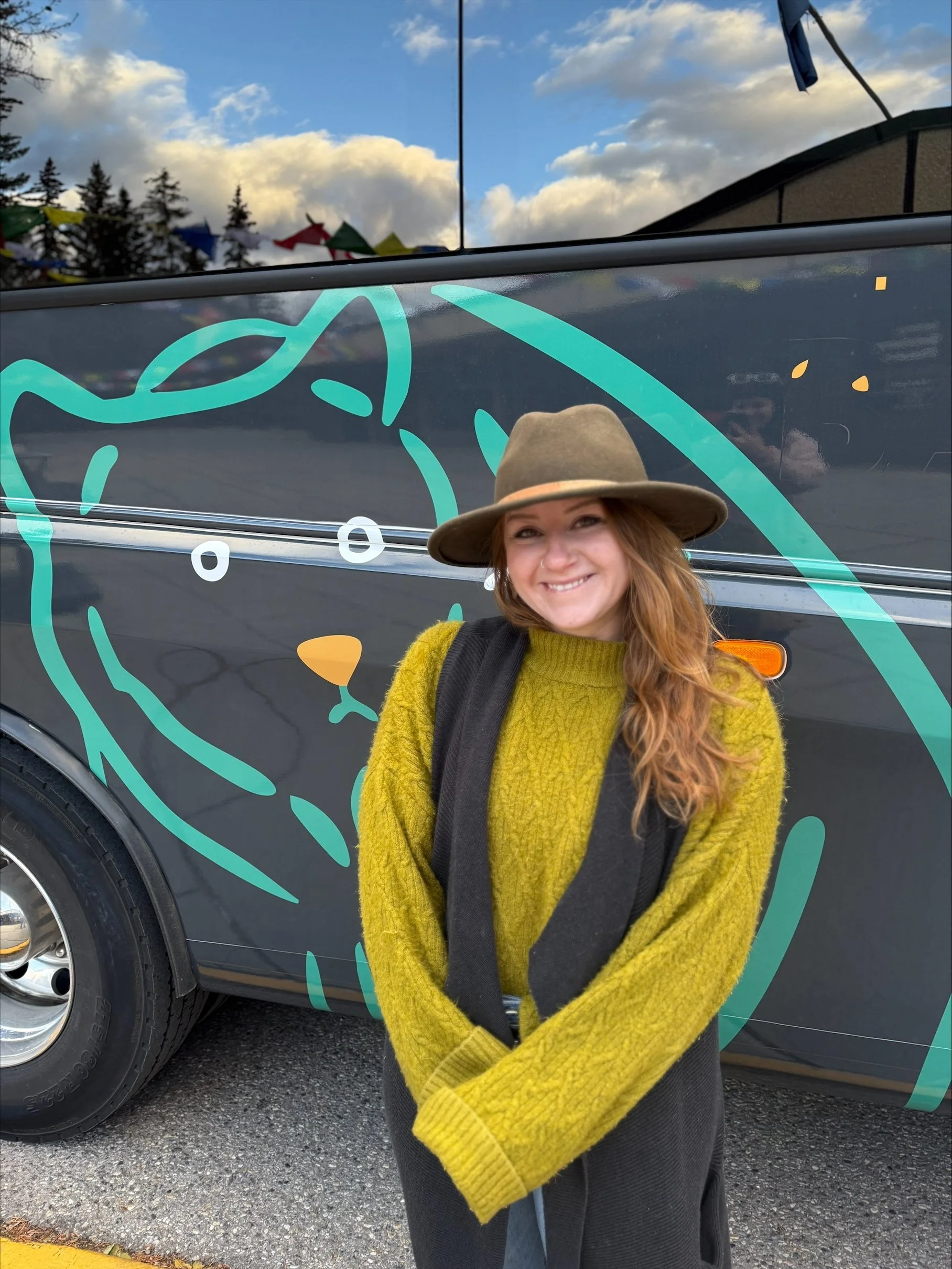 Teenybotanist beside the Banff Airporter shuttle wrap
