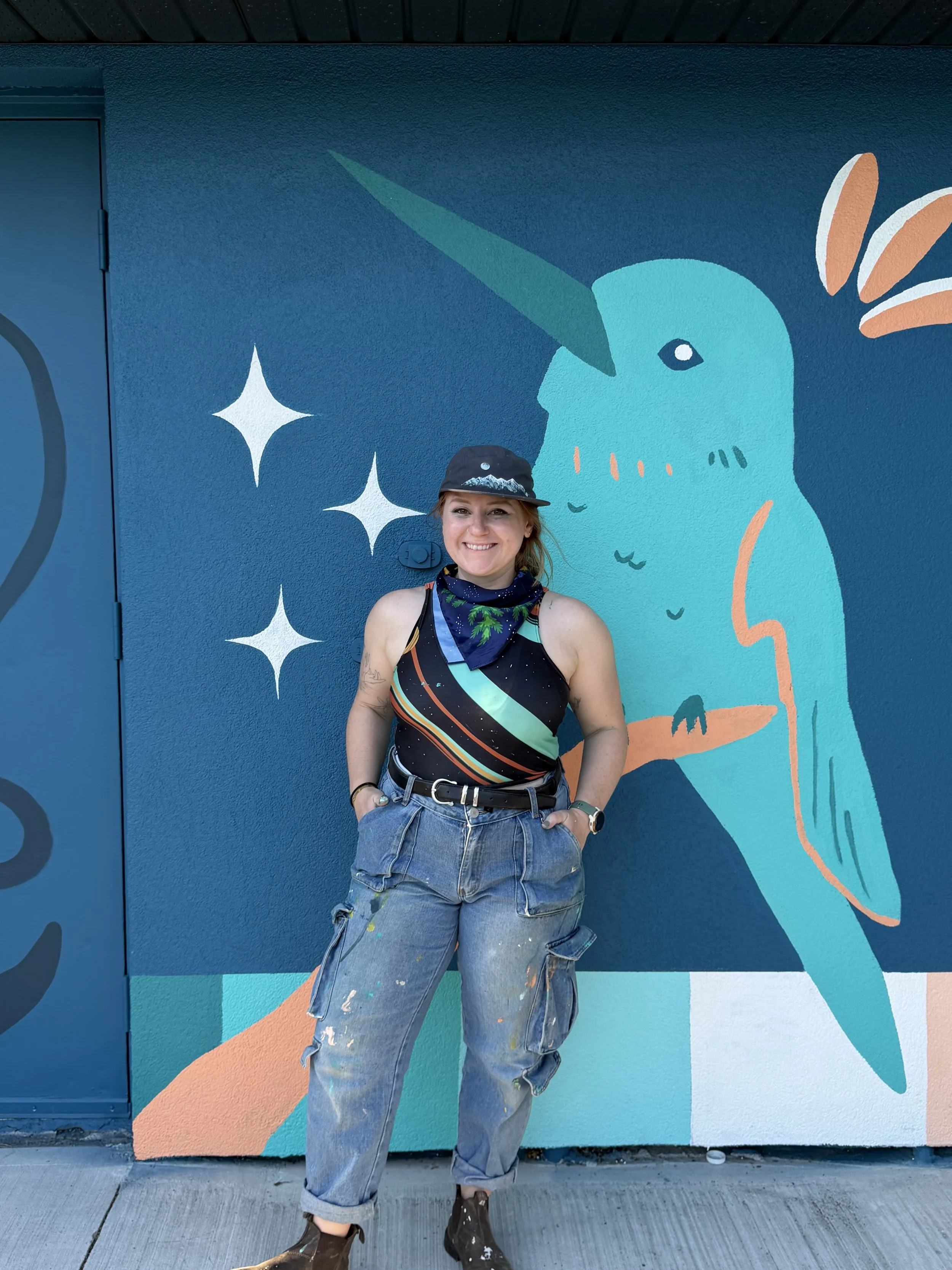 Teenybotanist beside her bird mural at Aspen Gardens