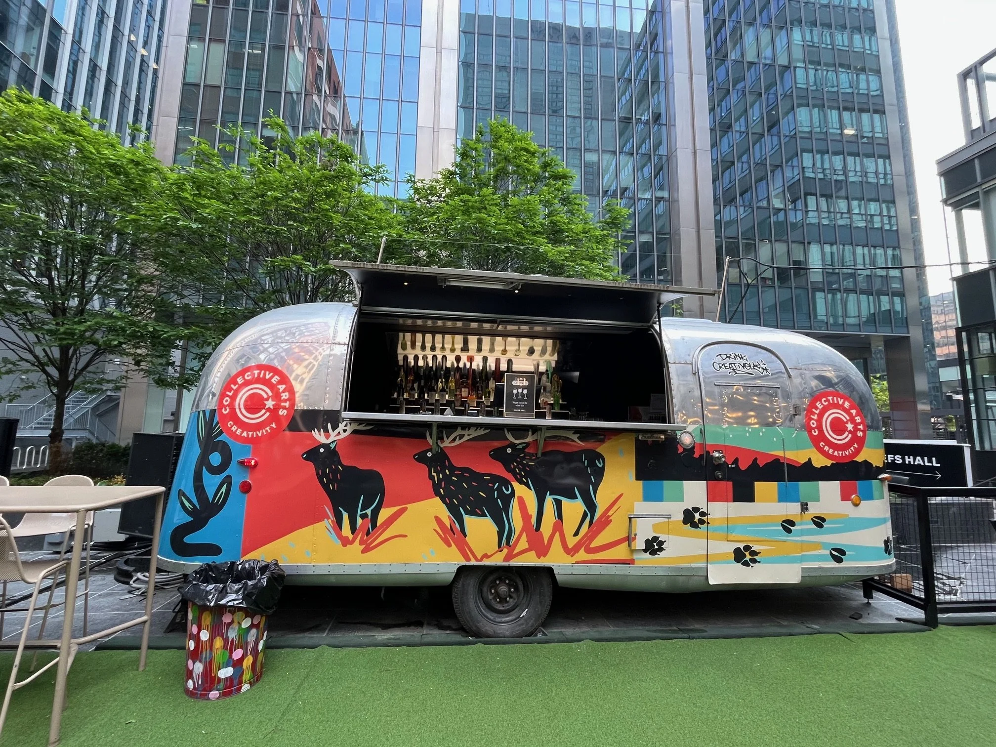 Side view of the wrapped Collective Arts Airstream