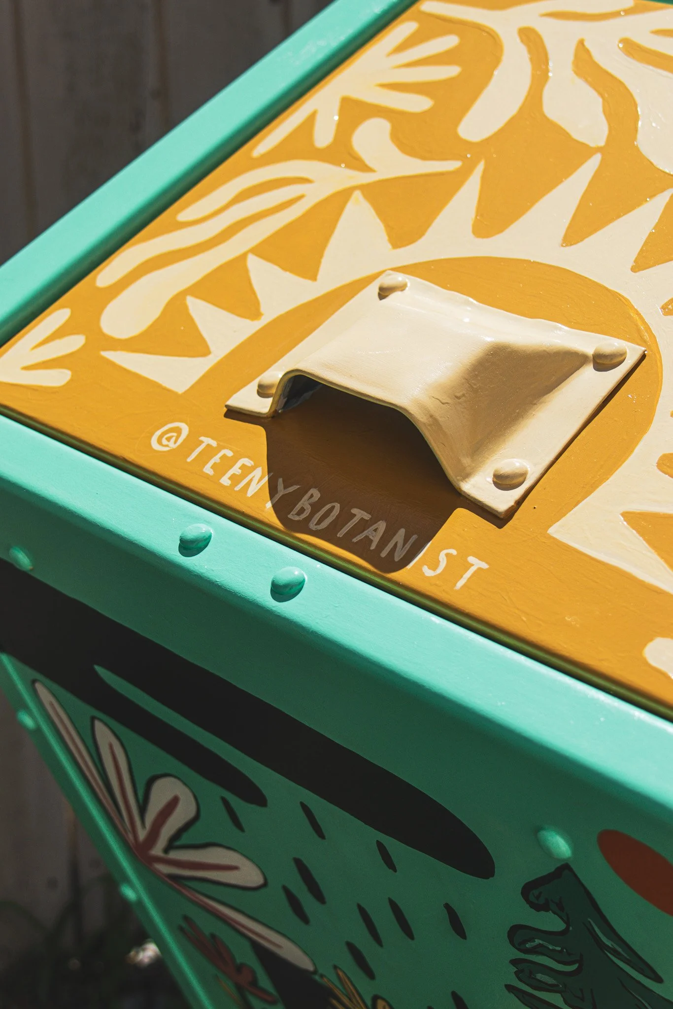 Close-up of the handle on the Okotoks bear bin