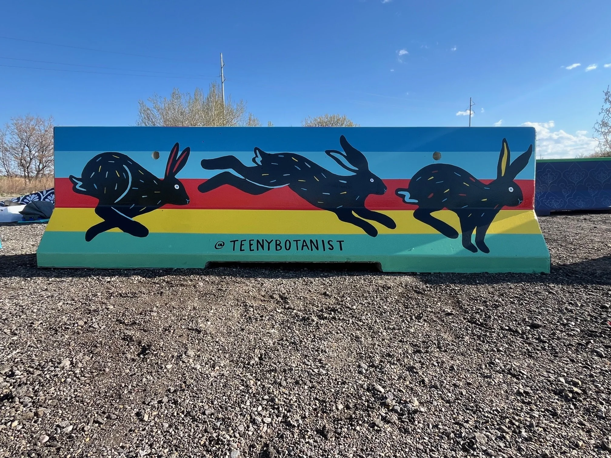 Jersey barrier painted with a fish and florals, BUMP Road Works by Teenybotanist