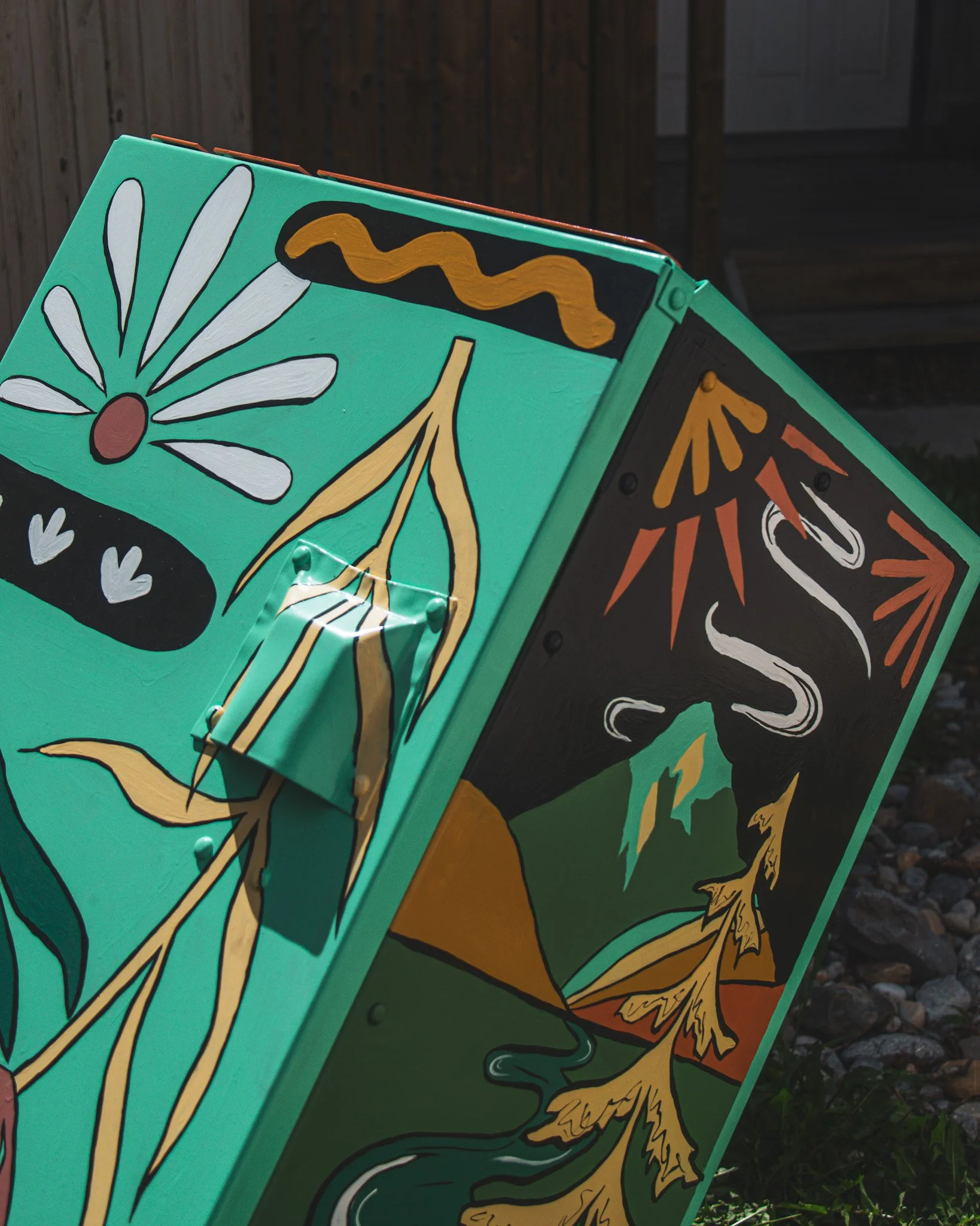 Close-up of painted florals on the Okotoks bear bin