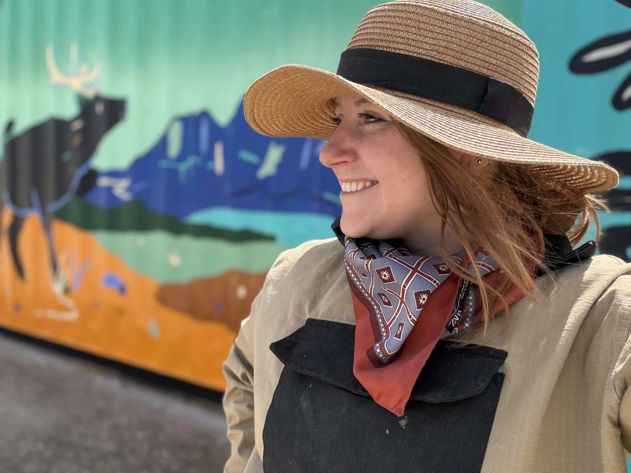 Teenybotanist in front of her Recovery in Colour mural in Jasper