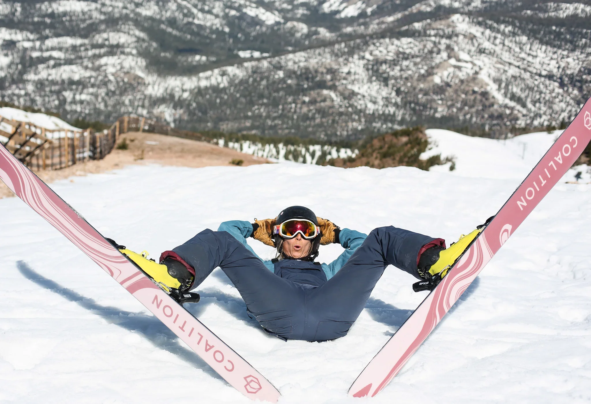 Skier relaxing in the snow with La Nieve skis