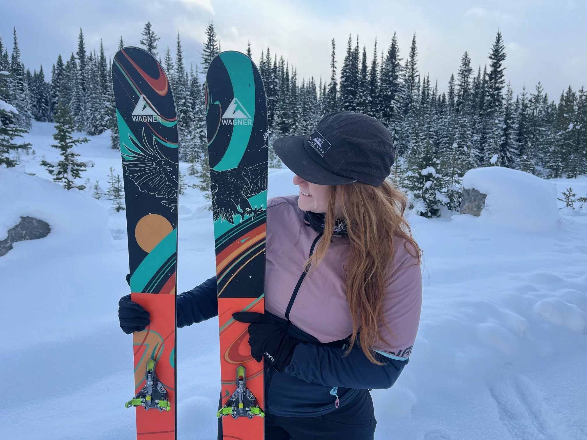 Teenybotanist holding her Wagner Artist Series skis in the snow