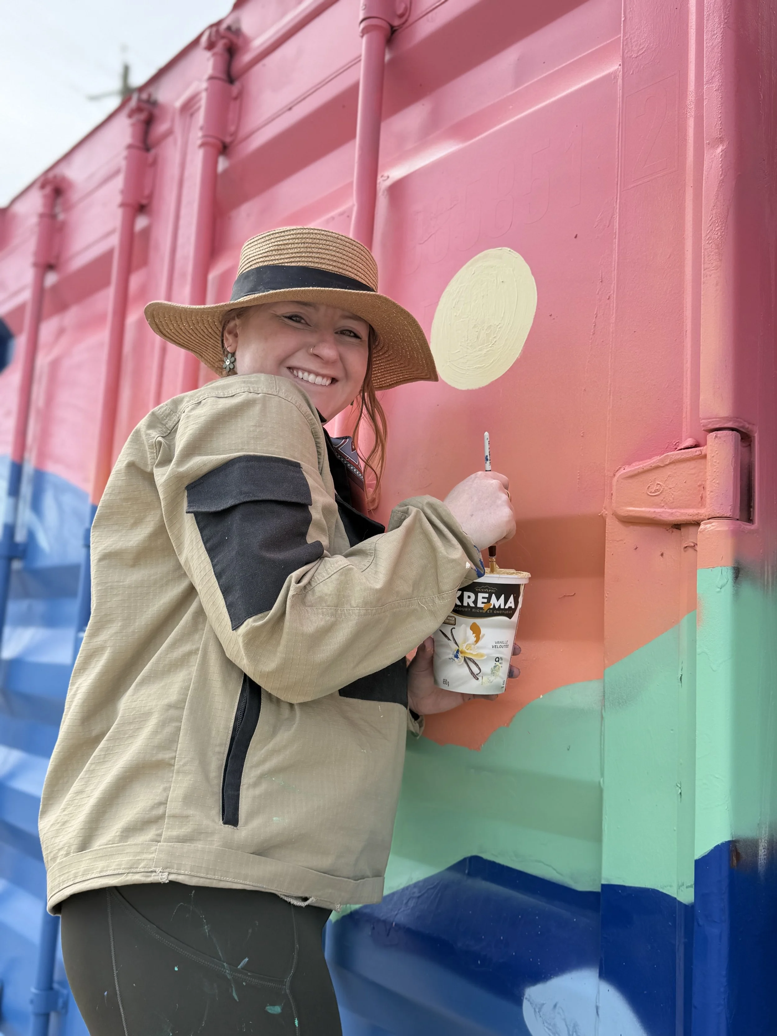 Teenybotanist painting the Recovery in Colour sea can mural