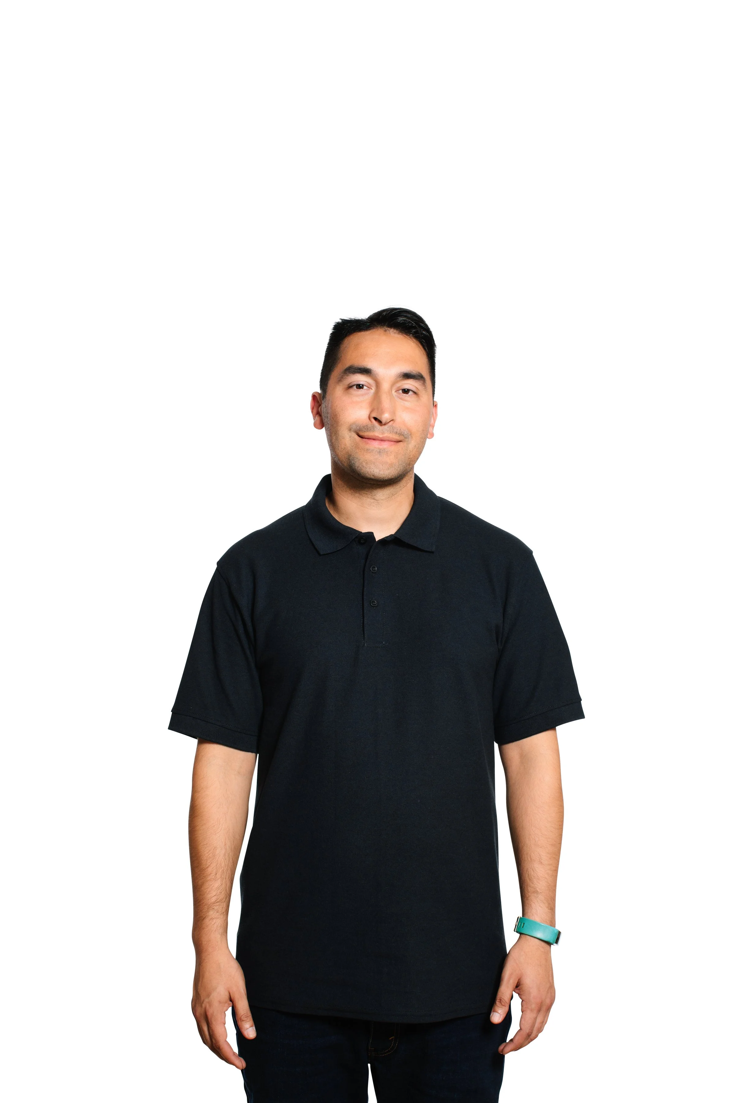 A man standing against a white background, wearing a black polo shirt and a teal wristband.