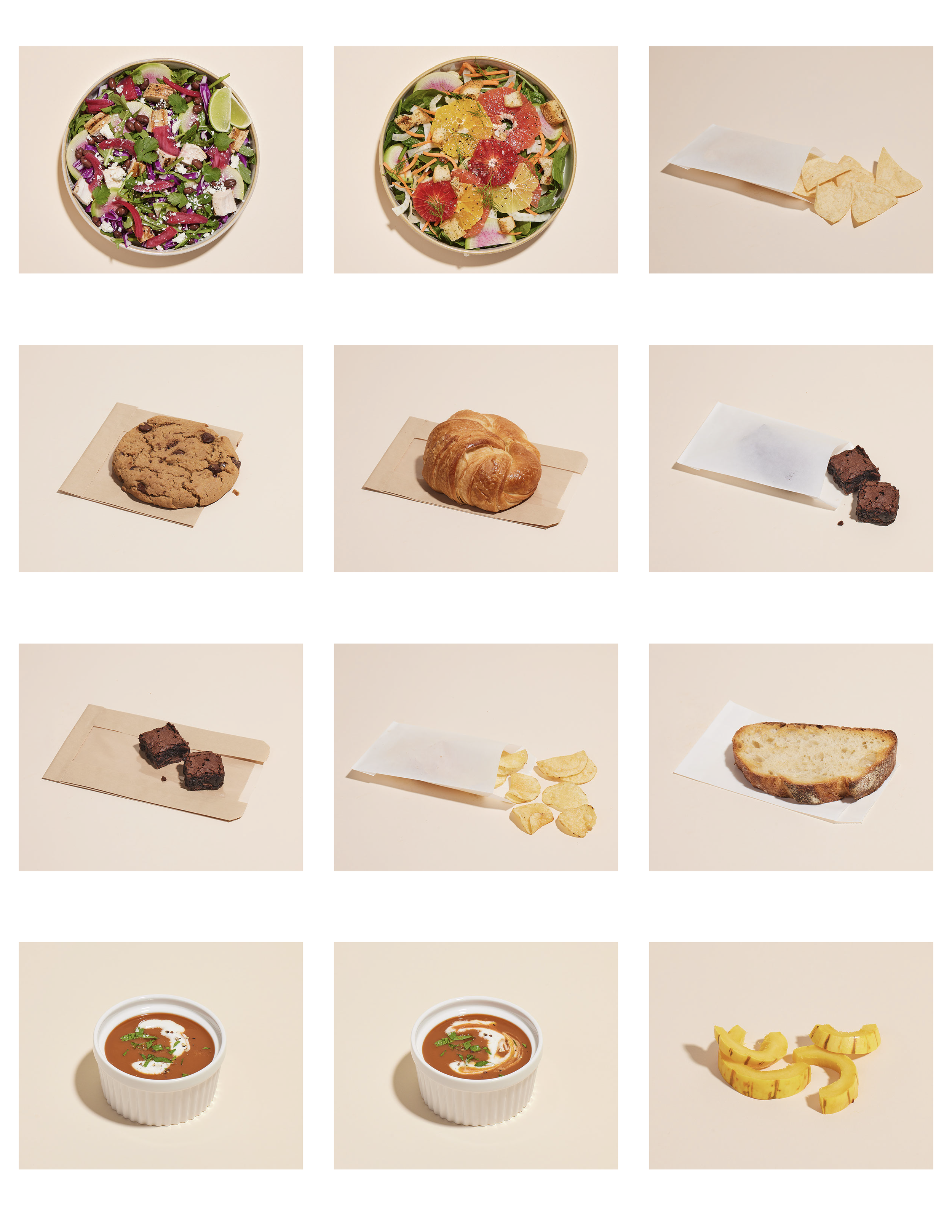 A grid of various food items including two salads, two servings of tomato soup, an oatmeal chocolate chip cookie, a croissant, a slice of bread, potato chips, brownie squares, and sliced yellow bell peppers.