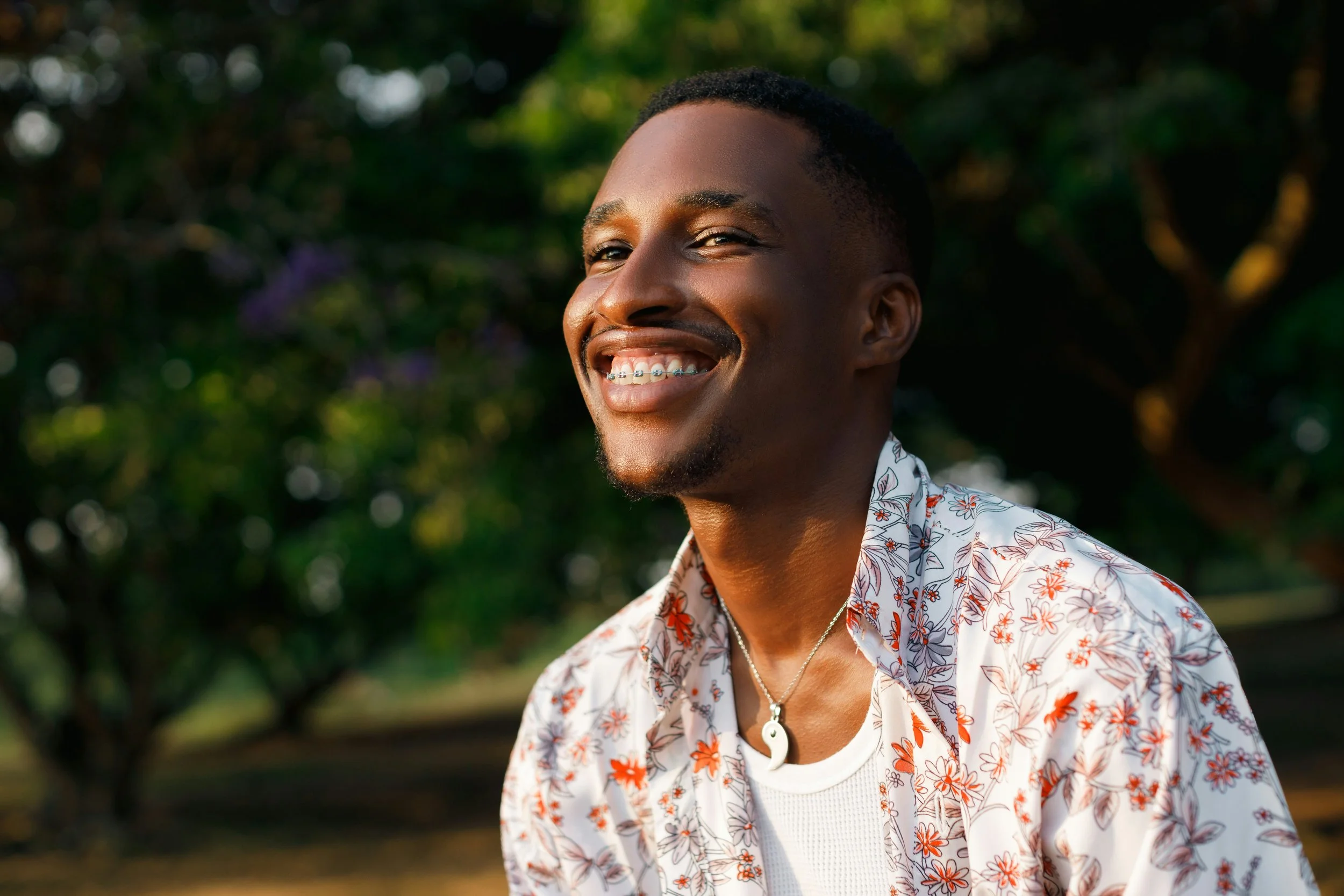 An adult patient smiling after clear ceramic braces treatment at Beth&rsquo;s Braces in Las Vegas