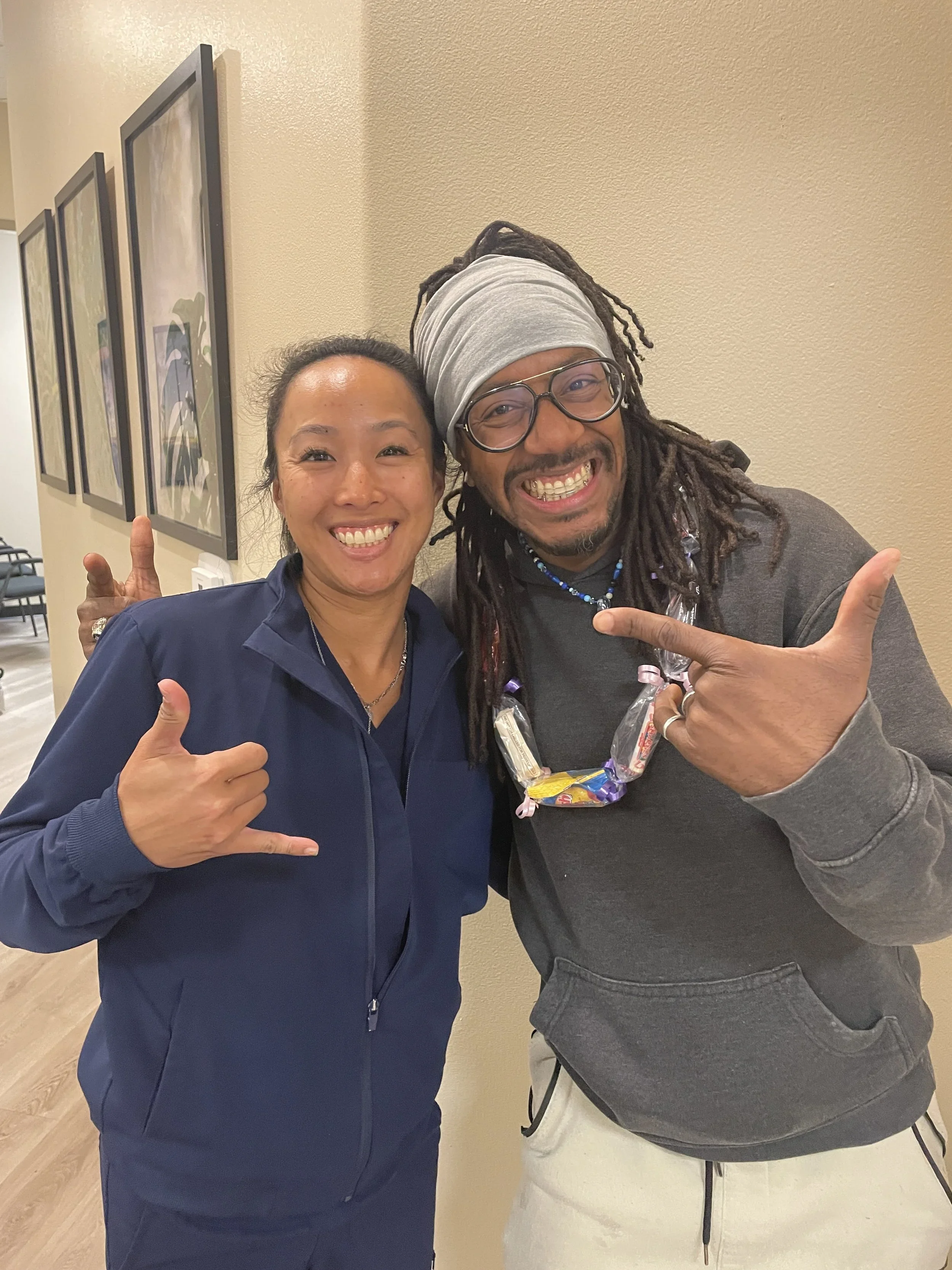 Adult patients smiling after discreet orthodontic treatment at Beth&rsquo;s Braces in Las Vegas