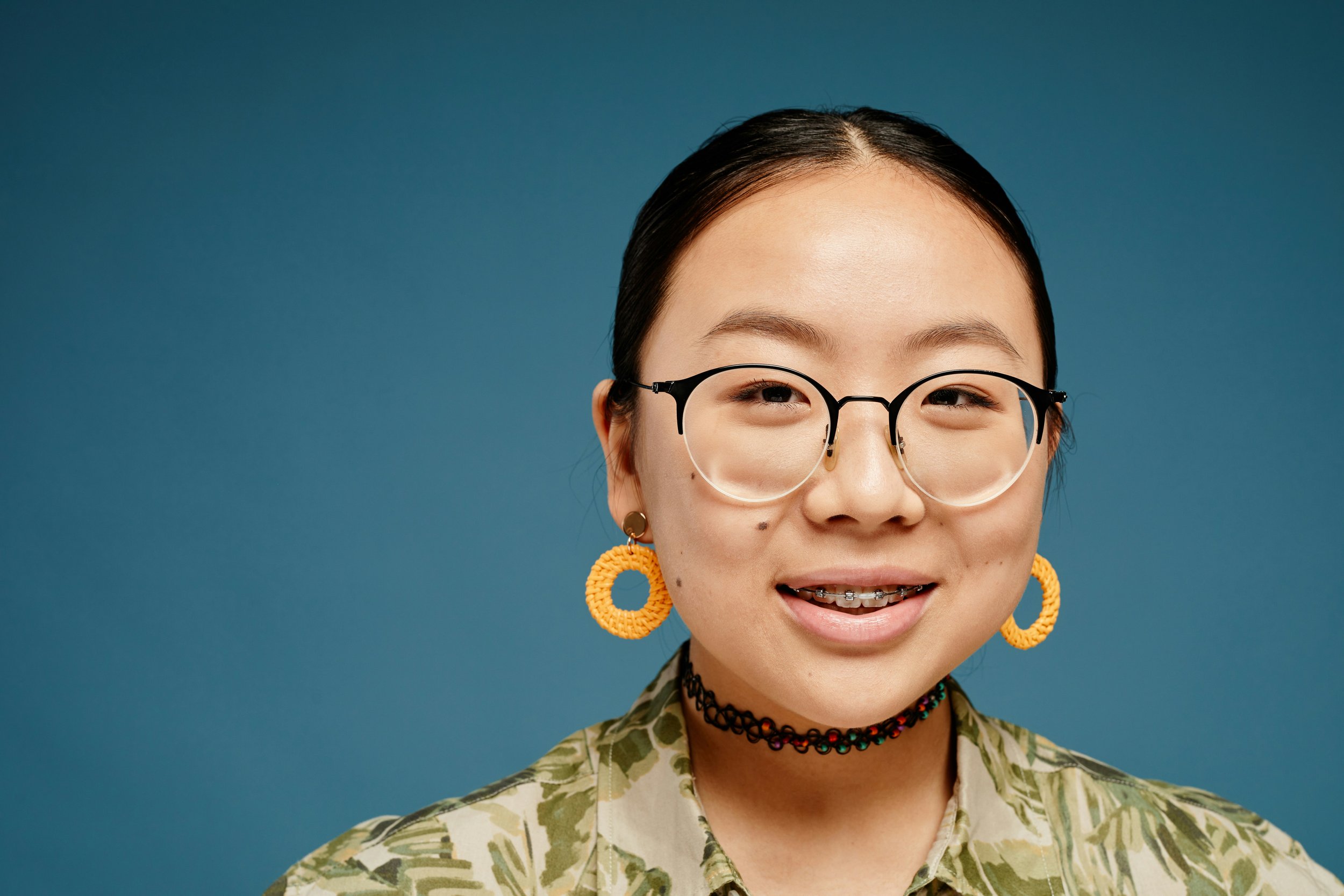 A patient smiling with braces after orthodontic treatment at Beth&rsquo;s Braces in Las Vegas