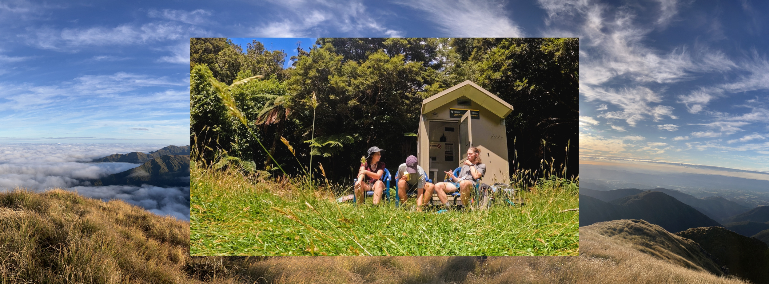 Three people sitting outdoors in front of a small shelter, surrounded by green grass and trees, having a conversation at a daytime park or nature reserve.