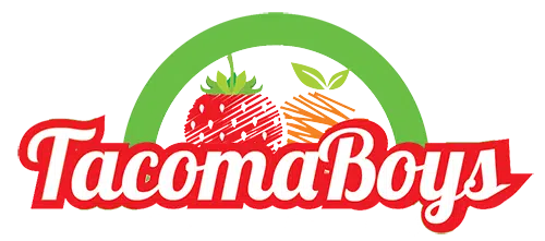 Close-up of a Tacoma Boys logo featuring a strawberry and carrot with green leaves on a circular background.
