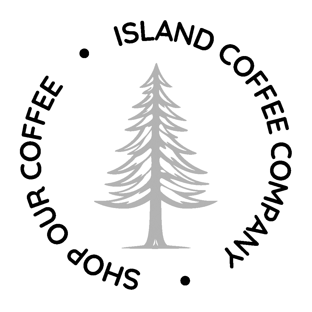 Logo of the Shoppoholics of Island Coffee Company featuring a gray pine tree in the center and circular text around it.